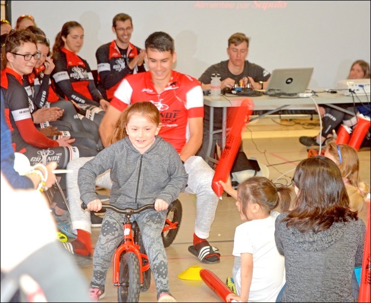 Grade 1 student Jordyn Hurley was given the opportunity to race around the Père Mercure gym against a Grande Traversée participant. La Grande Traversée is a program for French students who travel on bikes across Canada. The group stopped at École Père Mercure last week for a night, and the school hosted a pancake breakfast in the morning. Père Mercure students in turn sang a song to the travellers. Photos by Josh Greschner