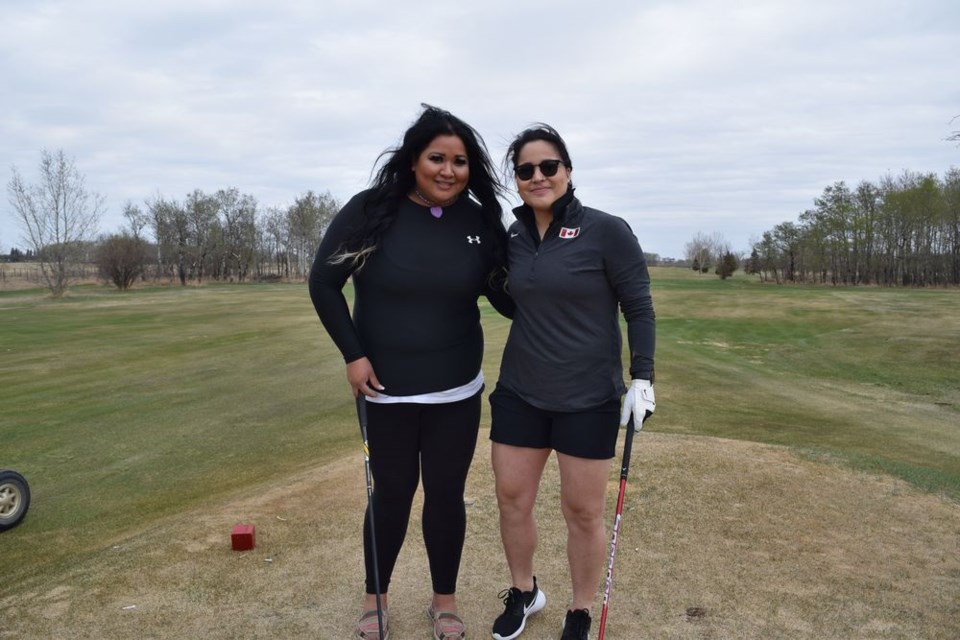 The sky was overcast and the breeze was chilly but that did not stop Olympic silver medal winner, Brigette Lacquette, and friend, Tara Cadotte, from playing a round of golf at the Kamsack Riverside club.