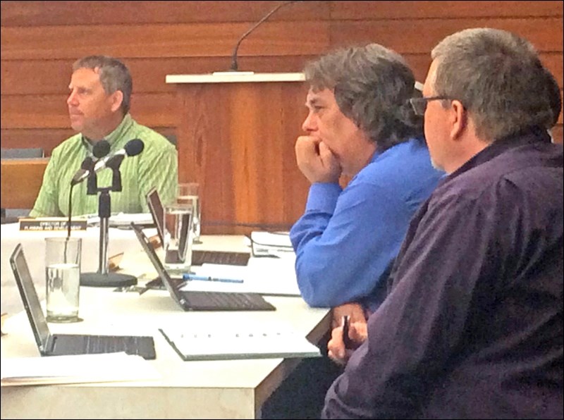 Director of infrastructure Dan Loewen sits across from acting City Manager Bill Samborski and Director of Utilities Stewart Schafer at Tuesday’s planning committee meeting, where service roads were a prime topic.