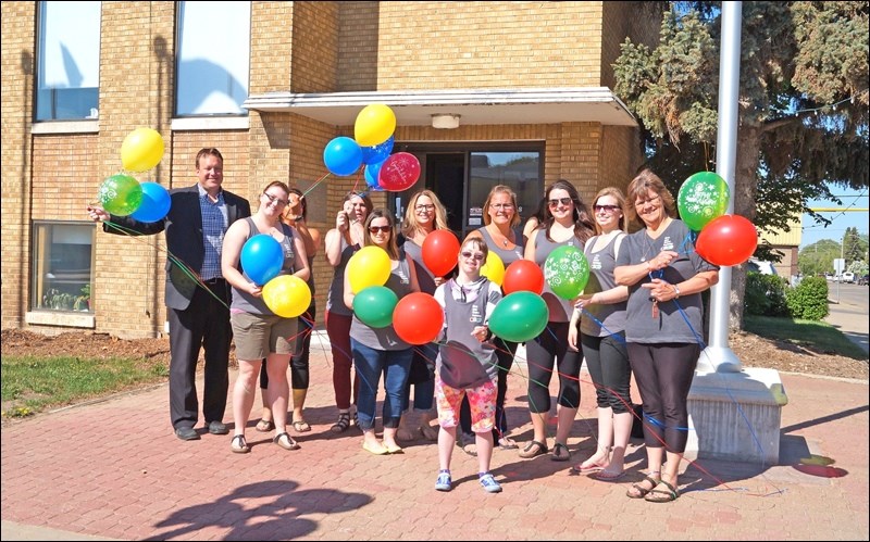 Up, Up and Away — Mayor Ryan Bater, far left, joined organizers and participants in Early Childhood Intervention Program Week in launching balloons to signal the beginning of the week’s activities. The week consisted of Circle of Learning events and toddler activities and wraps up with the annual Teddy Bear Clinic from 1 to 3 p.m. Friday. Photos submitted