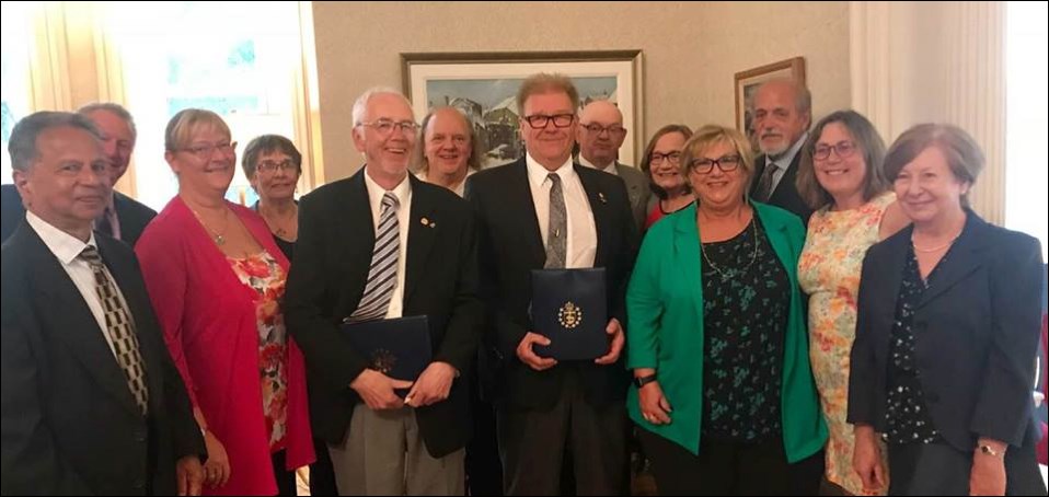 Flin Flon history teacher Gerry Clark (left, holding award) and archivist Don Peake (right) were recently awarded the Lieutenant Governor’s Historical Preservation and Promotion awards for their work in preserving the city’s past. - PHOTOS BY KAREN MACKINNON