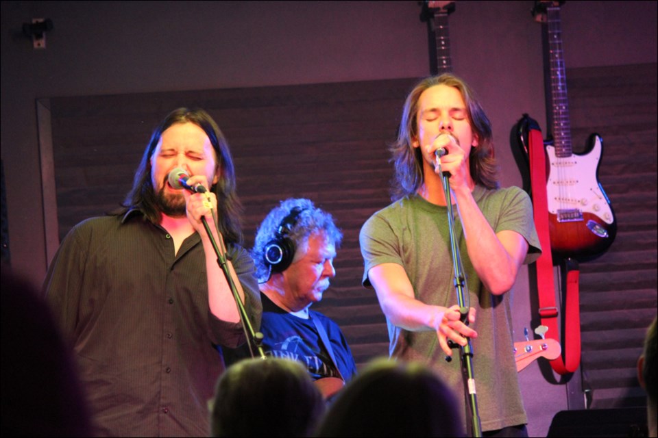 Kevin Imrie and Derek Kemp perform lead vocals during Pink Floyd Night at Johnny’s Social Club on May 25. - PHOTO BY CYNTHIA BIGRIGG