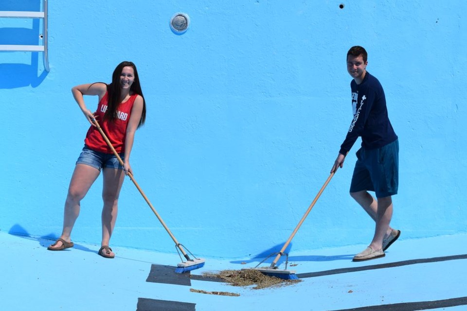 Canora swimming pool staff members Janayah Merriam and Brett Popoff were hard at work on May 23, getting the swimming pool ready for the planned opening on June 1.