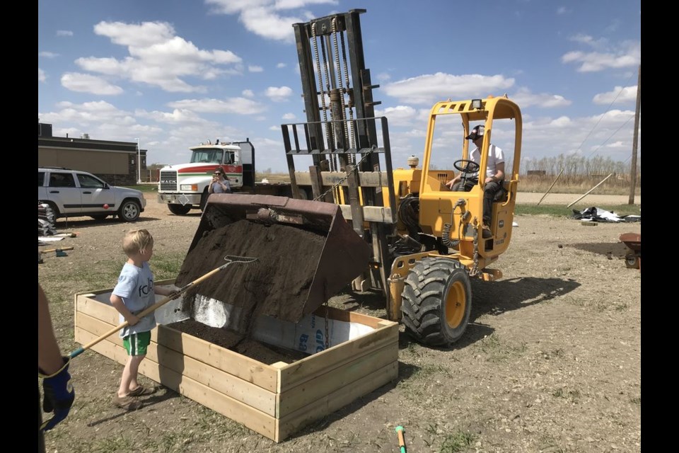 Volunteers built nine raised-bed planter boxes on the lot which the former Arrow Diner once occupied. These plant beds are the beginning of the Kamsack Community Garden.