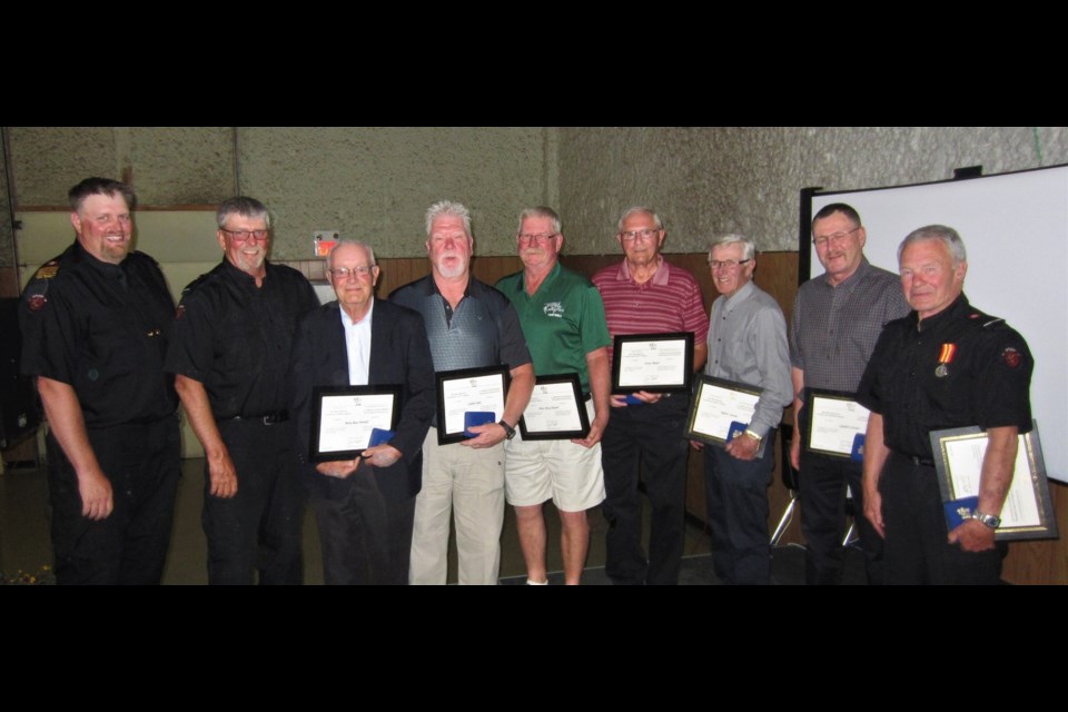 Chief Dalas King with award recipients George King, Ross Derdall, Calvin Clark, Hank Halseth, Larry Baxter, Robert Larson, Lyndon Larson and Bob Reid.