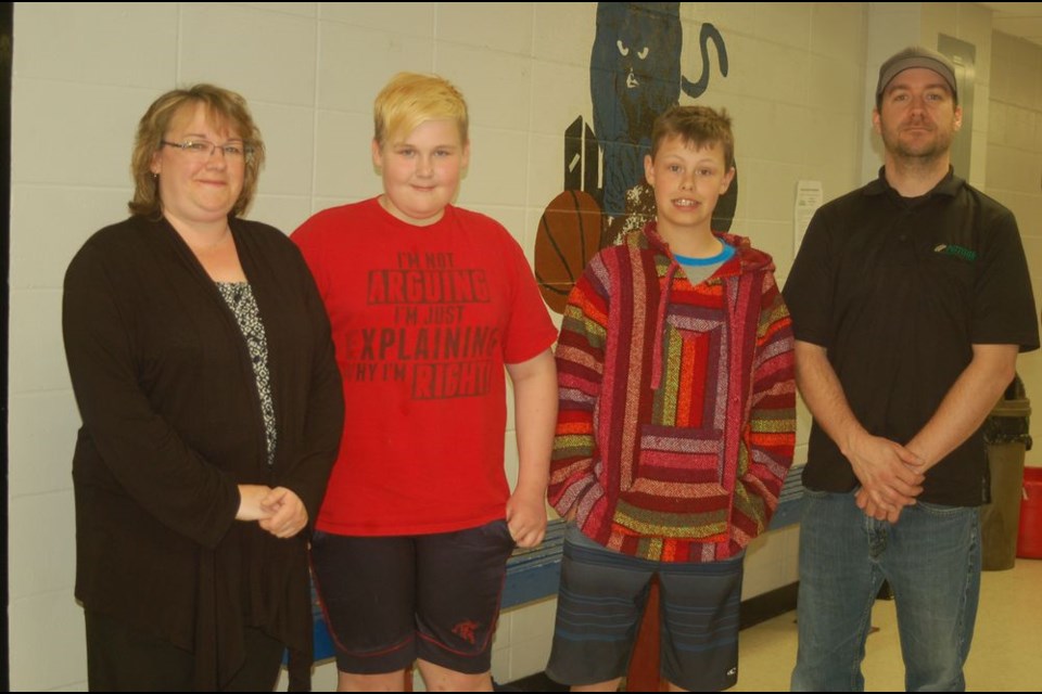 The Preeceville Wildlife Club will be sponsoring Lyndon Gawrelitza and Hudsyn Nelson to attend the Saskatchewan Wildlife Federation Youth Conservation Camp at the Hannin Creek Education Facility in August. From left, were: Heather Gawrelitza, Preeceville branch member; Lyndon Gawrelitza, Hudsyn Nelson and Shane Nelson, SWF Preeceville branch member.