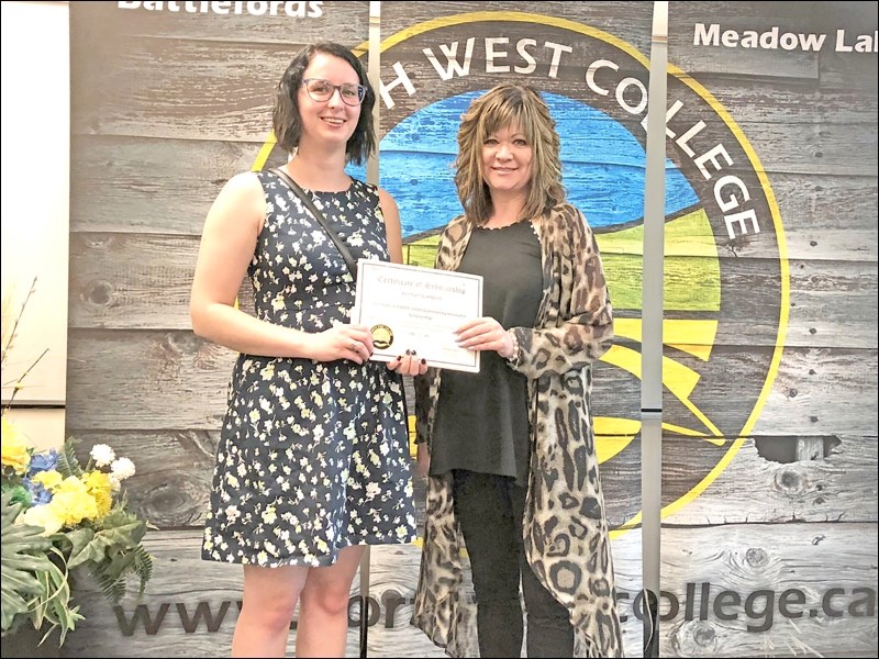Among the North West College students earning scholarships was Jordan Carbert, who accepts the Innovation Credit Union Community Innovator Scholarship from Dana Rissling.