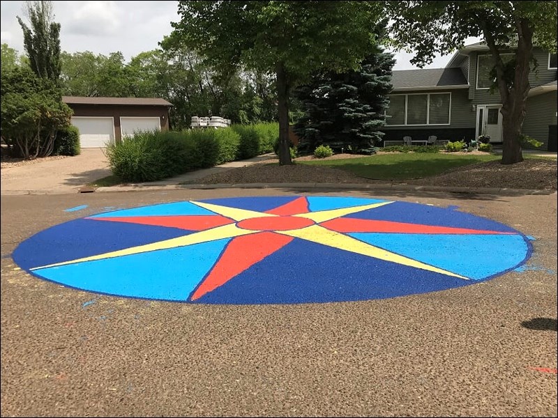 Meighen Crescent residents got together recently for a block party and a street mural resulted from the activities. Photos submitted