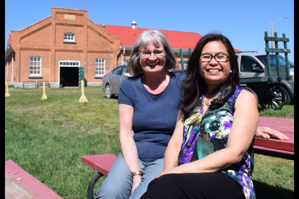 Darlene Brown, left, and Annie Morenos took a moment to enjoy the sunshine on May 20 at the Kamsack Power House Museum opening day.