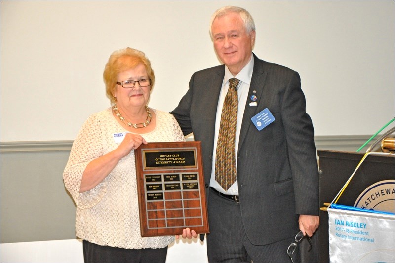 Sharon Mohagen with the Rotary Integrity Award presented by Wayne Ray.