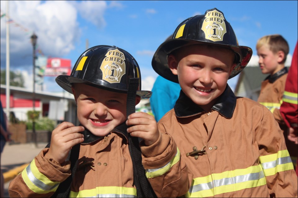 Parker and Zayden Meikle were all suited up and ready for the kids’ Beat the Chief event. - PHOTO BY ERIC WESTHAVER