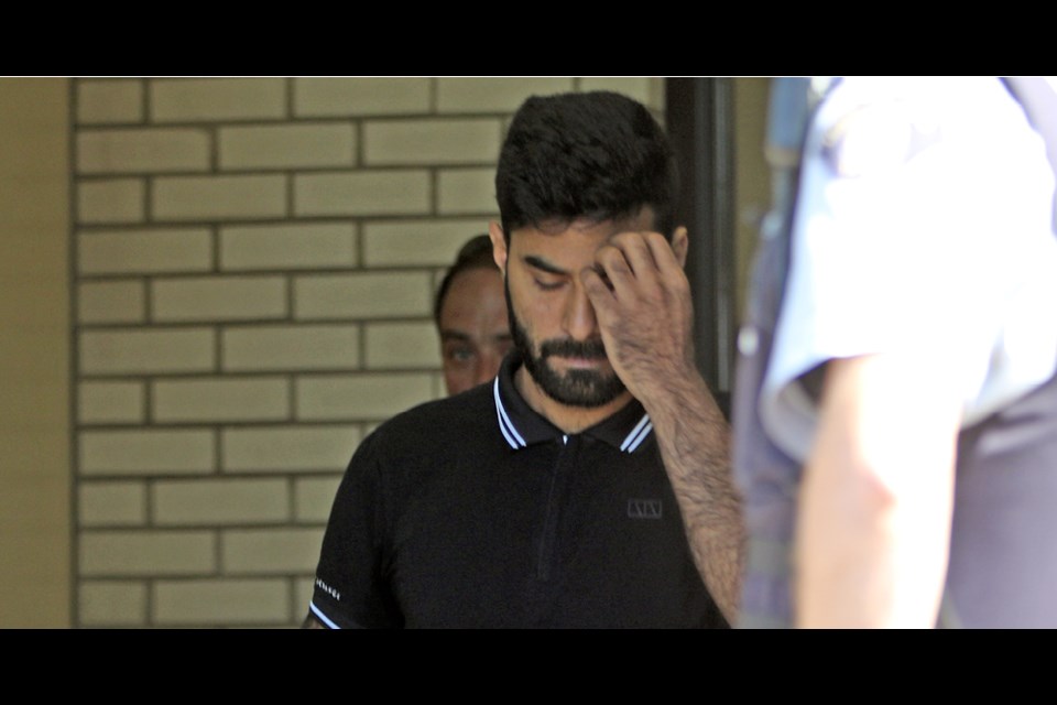 Jaskirat Sidhu, who was charged with 16 counts of dangerous operation of a motor vehicle causing death and 13 counts of dangerous operation of a motor vehicle causing bodily injury, leaves Melfort Provincial Court July 10 after his first court appearance. Photo by Devan C. Tasa