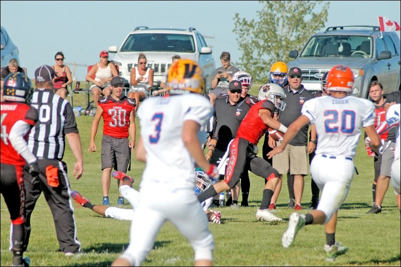 No. 30 Wyatt Radics of Hafford, did not play, but offers vocal support from the sidelines. Photos by Helena Long