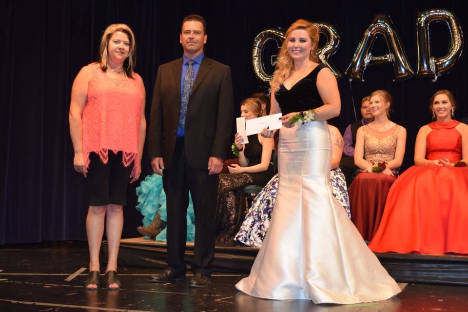 Heather Wiebe and Brent Pelechaty presented Abbey Sakal with the Crop Production Services scholarship. Sakal also won the Richardson Pioneer scholarship.