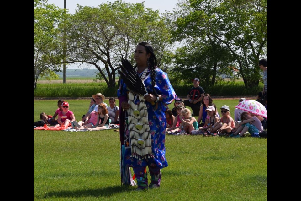 Cecilia Severight performed a women’s traditional dance, wearing a lighter tee dress and breast plate.