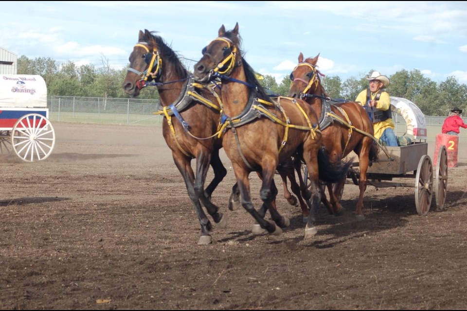 Larry Salmond encouraged his team of horses at the beginning of the chuckwagon race during the Preeceville and District Lions Club Western Weekend, held from July 13 to 15.