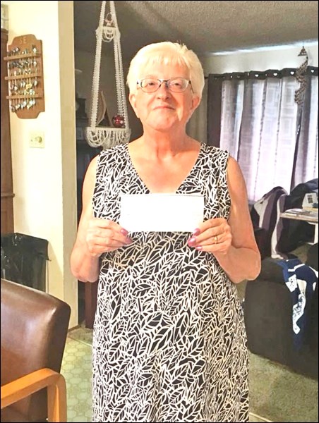 Sharon Eichenlaub was the winner of $557.50 in Wilkie Museum’s grasshopper drop.