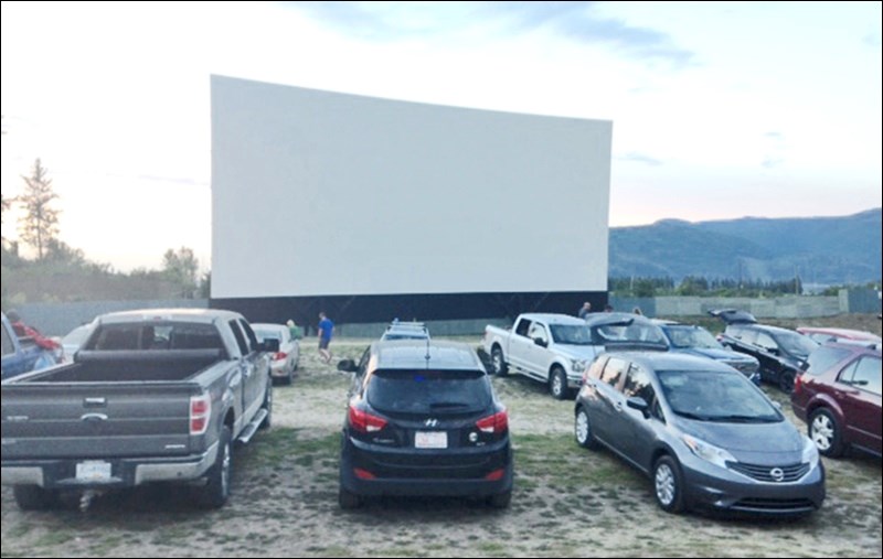 Patrons at the Starlight Drive-In can watch the featured movie in their vehicles or sit outdoors on folding chairs. The screen is billed as the biggest in North America. Photos by John Cairns