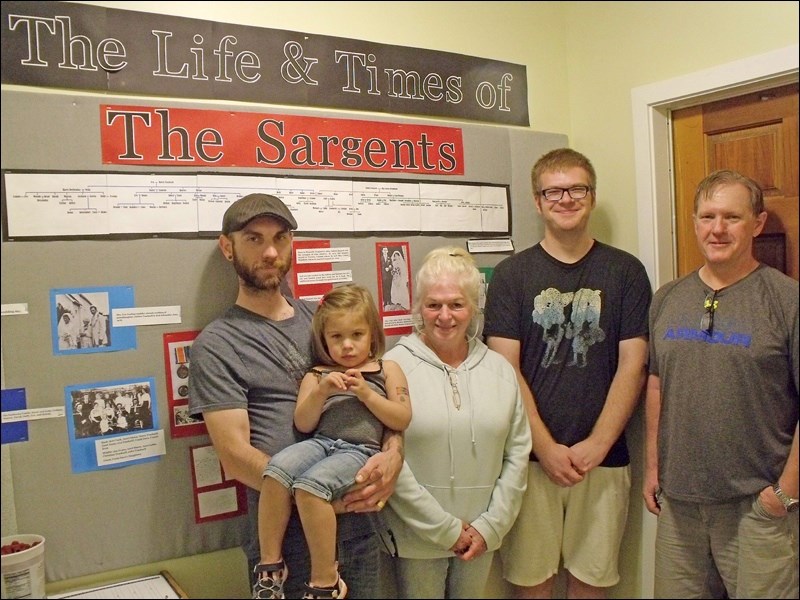 Adam Sargent (son of Bill and Karen Sargent) and daughter, Laura Unruh (nee Sargent) and Graham and Jonathon Sargent with the Sargent family history display at Borden Museum.