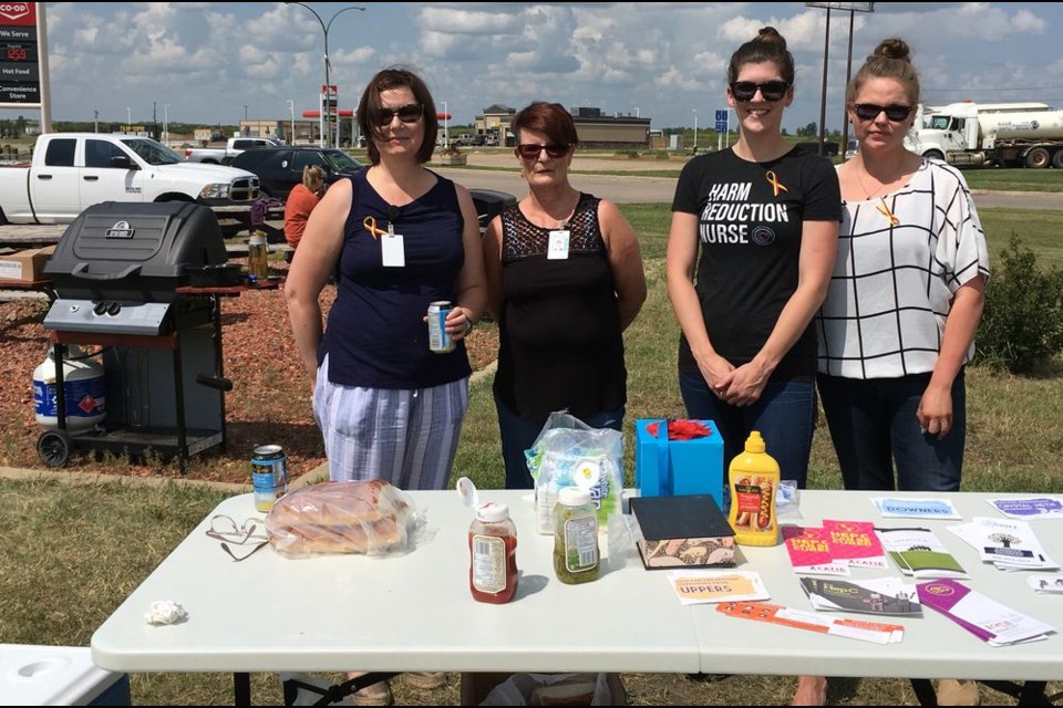 From left, were, Deanna Bartok, Glenna Stringer, Cassandra Whalley and Santana Cote who helped at an event to raise awareness about hepatitis C on July 27.