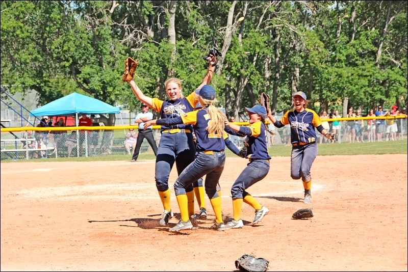 The Unity Panthers U19 celebrate on the mound before accepting their medals and pose for a team photo as they captured the U19 Western Canadian Softball Championships in front of a home town crowd on august long weekend. Photo submitted by Sherri Solomko