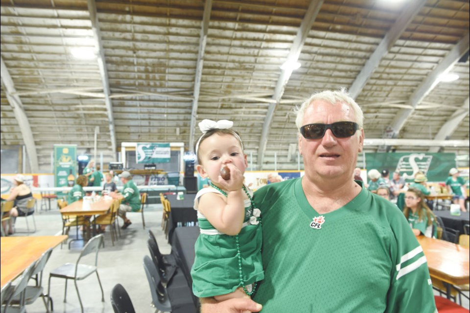 Bryan Fleck and his granddaughter Addison Fleck enjoy their afternoon at the Rider Block Party in Bienfait on Aug. 11. Bienfait was selected as one of six communities in Saskatchewan to host the Rider Block Party.