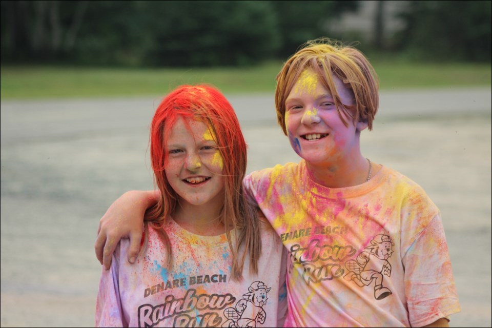 Both Sadie Durette and Leland Feuerstein were covered from head to toe in coloured cornstarch after the Denare Beach Rainbow Run on Aug. 11. - PHOTO BY ERIC WESTHAVER