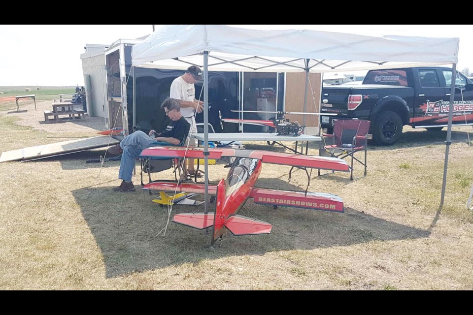 Members of Remote Control Hobbies avoid the sun at the 30-year anniversary of Sun City Prop Busters on Aug. 11.