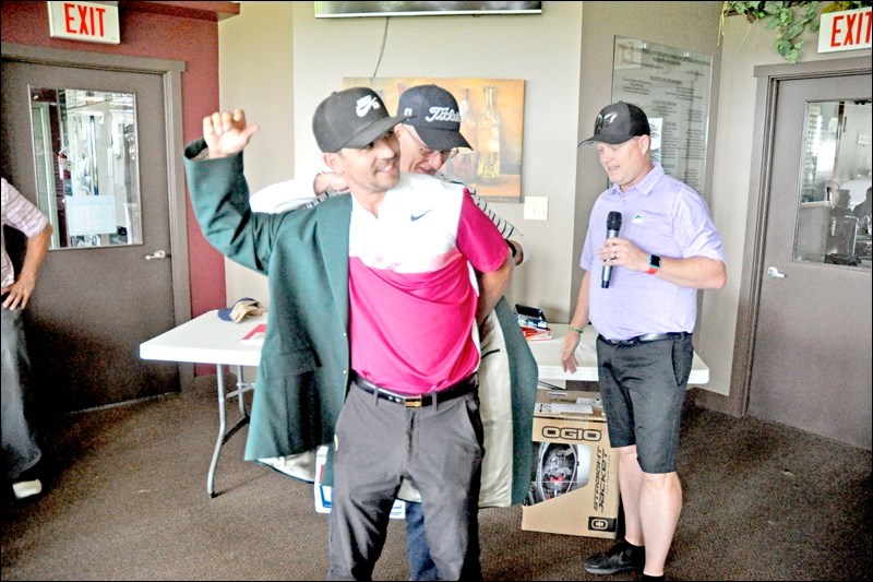 It could not have been better conditions for those on the golf course Sunday to finish the Molson Open. The grand prize went to Greg Swenson who took the championship flight with a two-day score of 148. Presenting Swenson with his prizes were tourney co-chairs Garry Flichel and Neil Lampitt and director of golf Dana Johnson. Photos by John Cairns