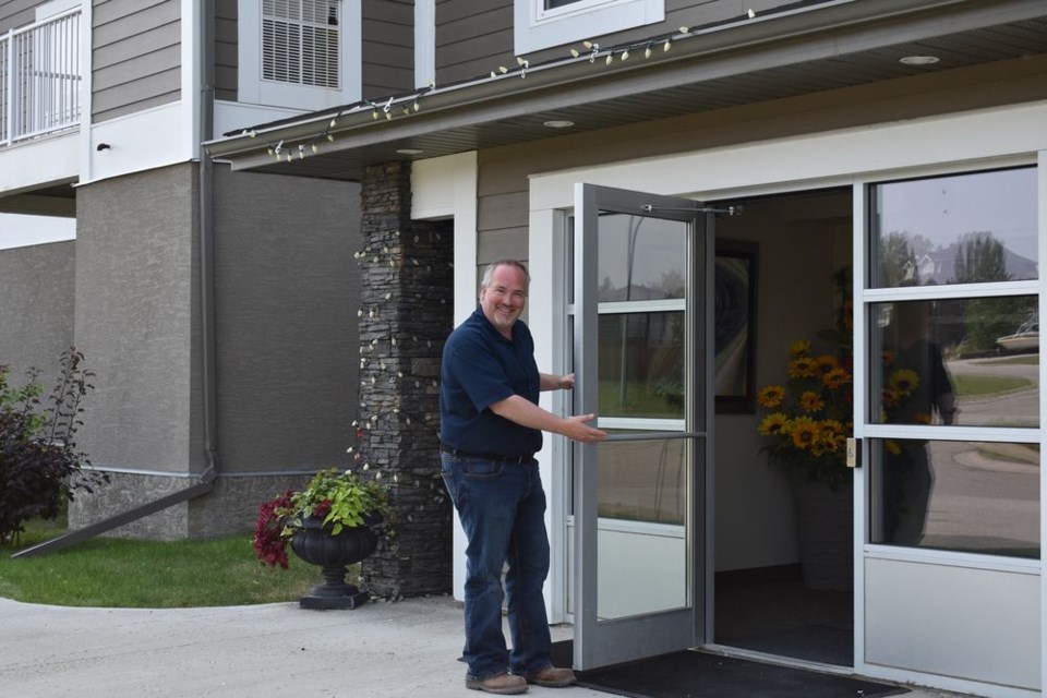Robert Ritchie stood at the door of the Assiniboine Valley Estates at 45 Lawrence Road which he recently purchased.