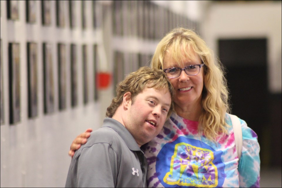 Jonathan Dougall hugs his mother, Arlene Collins. Collins, her husband Dwight and Dougall will be moving to Quispamsis, NB to be closer to family. - PHOTO BY ERIC WESTHAVER