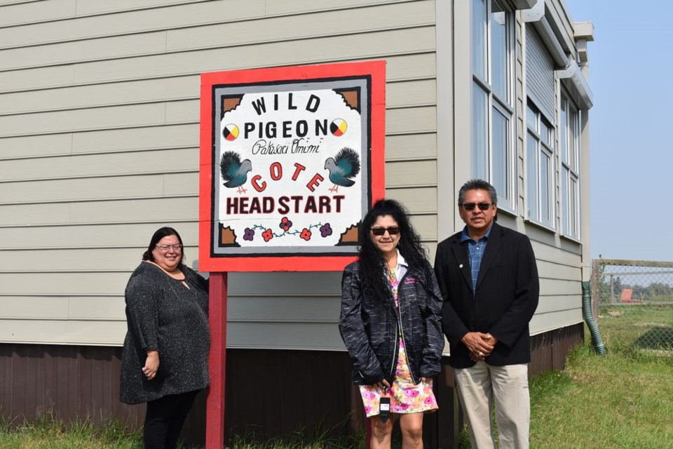 New, colourful signs are displayed at the Cote First Nation Daycare as it celebrated 20 years in operation on August 17. From left, were: Monica Perswain, director of daycare and headstart programs; Terrilyn Friday, headstart teacher and artist/creator of the new signs, and Chief George Cote.