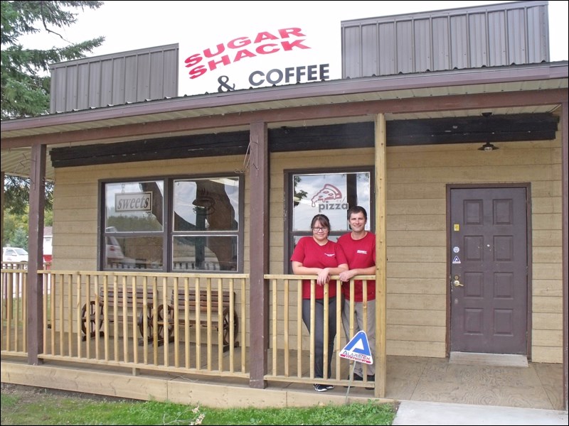 Marking the grand opening of T’Roy’s Sugar Shack and Coffee Shop in Borden are manager Madelaine Scrimbitt  and chef Christopher Klaasen.