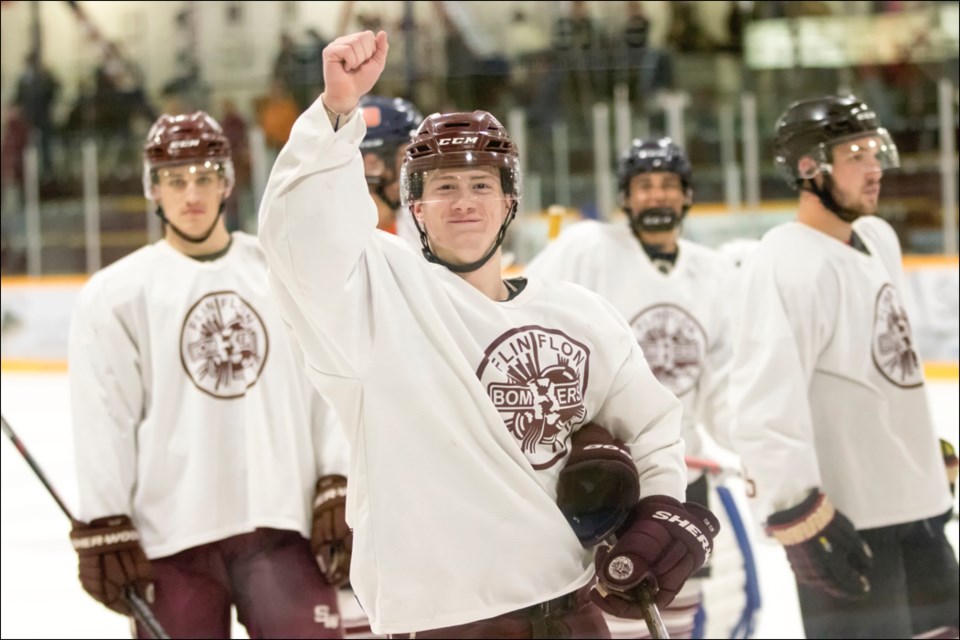 Caleb Moretz gives a victory fist pump after the Maroon and White game. Moretz finished the game with two goals and three points, including the overtime winner. - PHOTO BY KELLY JACOBSON