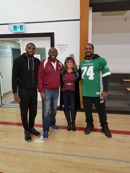 Makana Henry and Marcell Young, who play for the Saskatchewan Roughriders, attended the first annual Hoop Jam basketball tournament. From left, were: Young, Ken Keyes (program co-ordinator) and his wife Donna, and Henry.