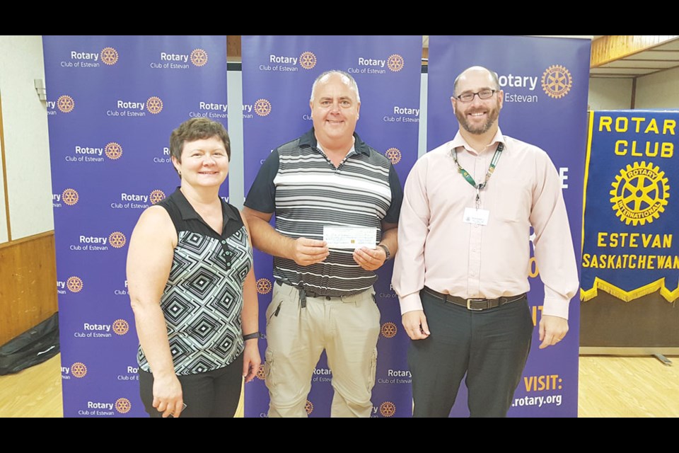Estevan Rotary Club Foundation chairperson Gloria Chicoine, City of Estevan parks and facilities manager Rod March and foundation representative Ryan Siever participated in a cheque presentation. Photo submitted