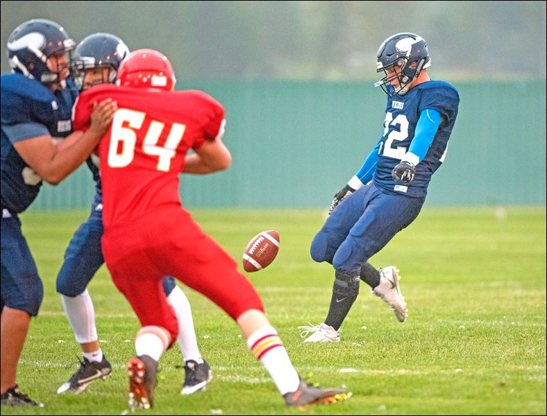 vikings JT Lamb punts the ball on third down. Photos by Averil Hall