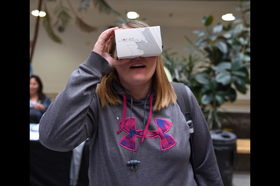 Grade 11 student Faith Dupas looks through a pair of virtual reality goggles that were made available to students at the youth safety presentation held at Estevan Comprehensive School on Sept. 17. The presentation was geared towards teaching youths their right to a safe work environment.