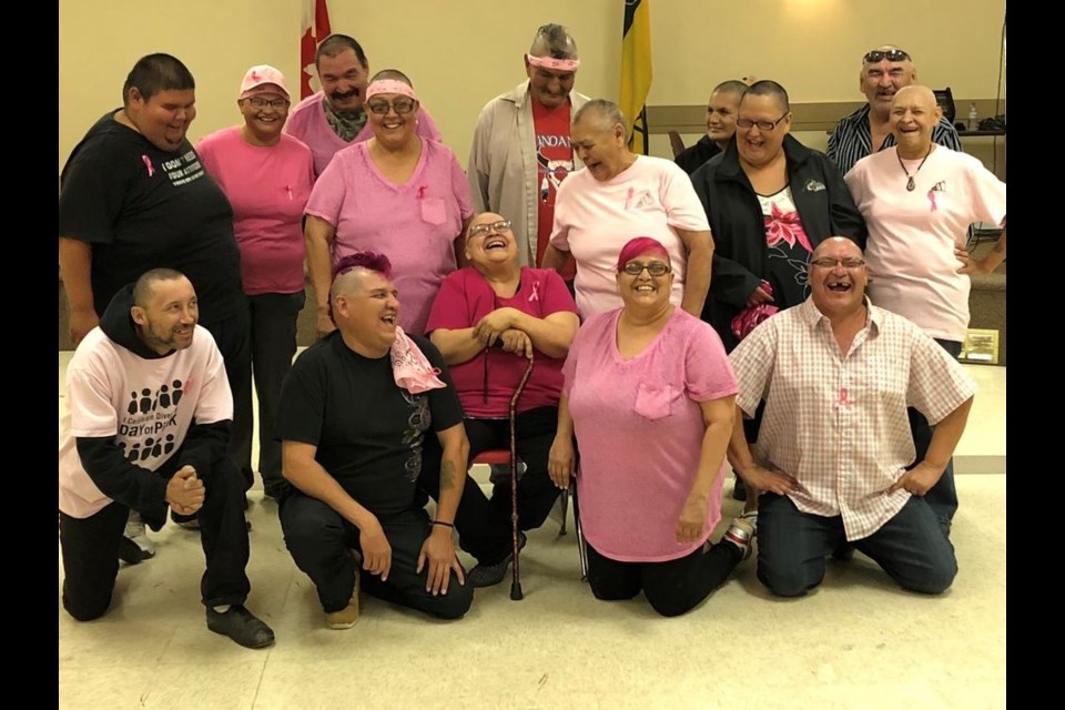 All smiles after heads shaved for a good cause. Family members who shaved their heads on August 31 in support of their loved one, Katherine (Munroe) Swanson, who is battling breast cancer, from left, were: (back) Doris Campeau, John Ketchemonia, Dennis Pangman, Carmen Shingoose and Joseph Genaille, and (middle) Anthony Munroe, Gloria Genaille, Sarah Genaille, Georgina Keewatin and Mary Buydens, and (front) Glen Pangracs, Durwin Genaille, Swanson, Georgeanne Genaille and Frank Keewatin. Unavailable for the photo were James Chartrand, Crystal Munroe, Fabian Genaille and Fred Genaille.