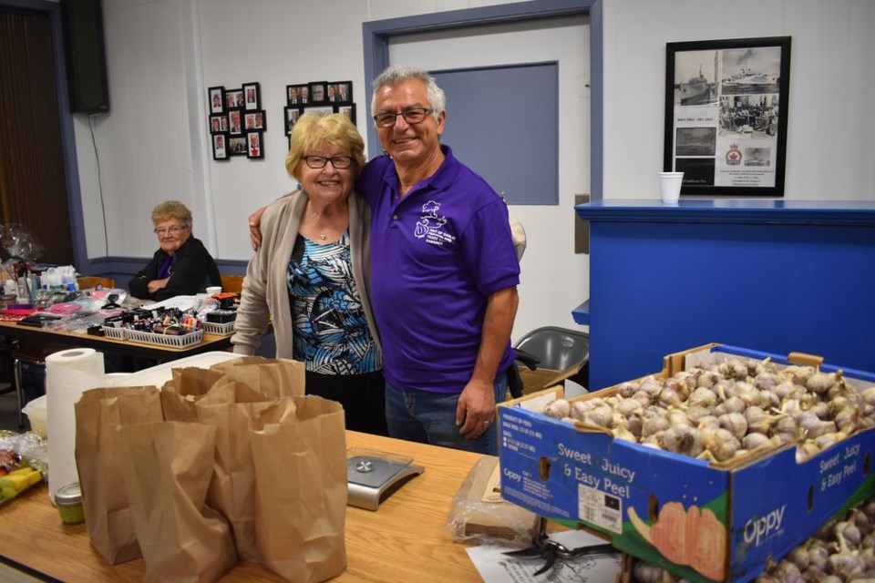 Anne Hudye of Kamsack was checking out the Russian Red garlic at the table run by Alfredo Converso of La Campagna Bed and Breakfast.