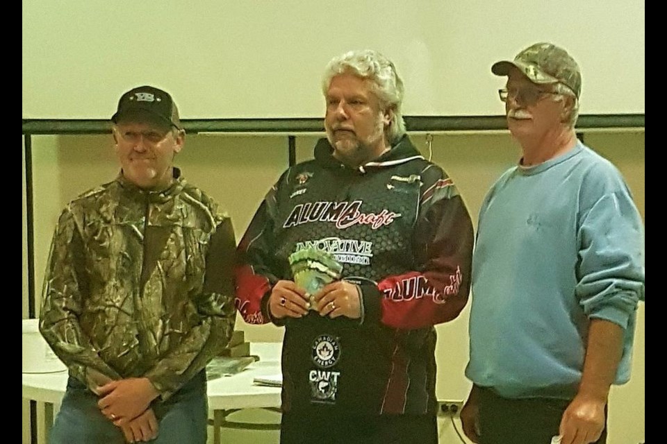 The angling team of Glen Becenko, left, and Vaughn Binkley, right, finished third in the Madge Lake Walleye Cup (MLWC) derby on September 15 for the second straight year. Presenting them with their cheque was James Turner of Regina.