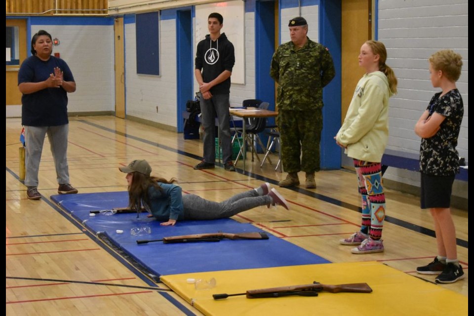 CO Karen Tourangeau, from left, (standing), gave instructions to the air cadet squadron members during range training night on September 12, while seventh-year cadet Cade Henry Martino, Don Thomson (zone training instructor), Brooke Taylor and Bobby Taylor looked on. Teanna Raffard was on the mat.