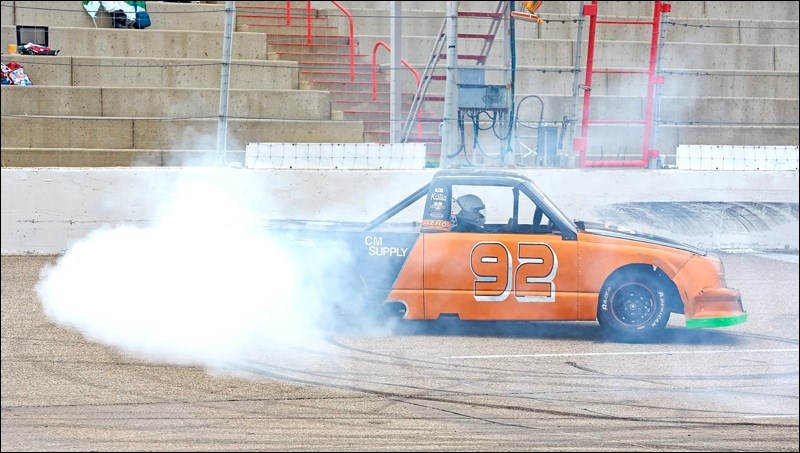 Brennan Kirton does donuts on the track to celebrate his win in the Pro Truck final.