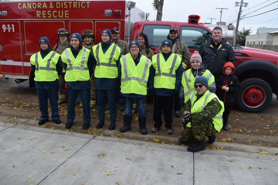 Canora air cadets teamed up with the Canora and District Fire Department and held a food drive on September 22. Before heading out from the fire hall, the groups got together for a picture. Firefighters in the back row were: Mike Skibinsky, Rick Gibson, Eric Sweeny, Sherise Fountain, Jess Harper, Neil Reine, and Mason Reine. Cadets in the front row were: F/Sgt. Joanne Babb, Sgt. Gracie Paul, F/Cpl. Tessa Spokes, AC Dawson Jennings, AC Gregory Severight, Max Paul and Capt. Darren Paul. Unavailable for the photograph were 2Lt. Wade Stachura and AC Tyrell Toto.