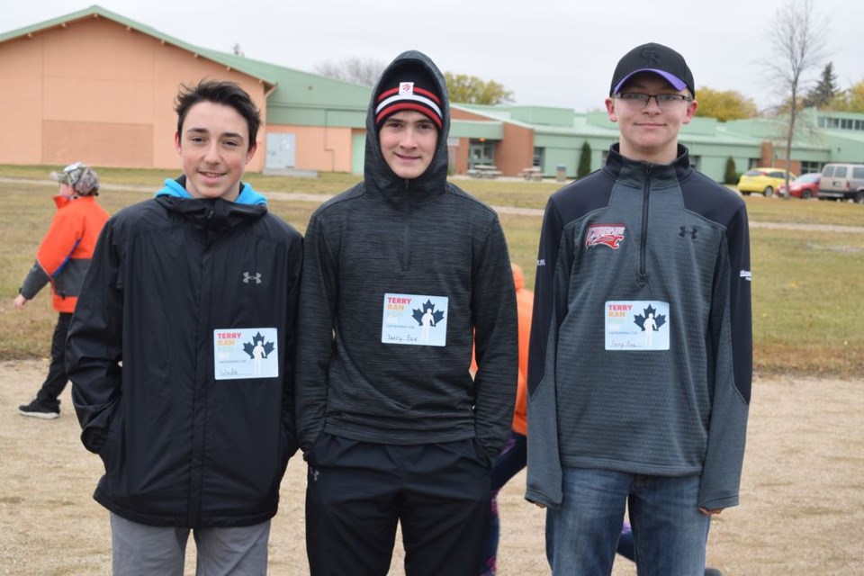 CCS students were given stickers which said, “Terry Fox ran for me, I’m running for…” The students were encouraged to run for someone they know who was affected by cancer. From left, Dawson Zuravloff ran for his cousin Wade, while Hudson Bailey and Brody Harrison ran for Terry Fox.