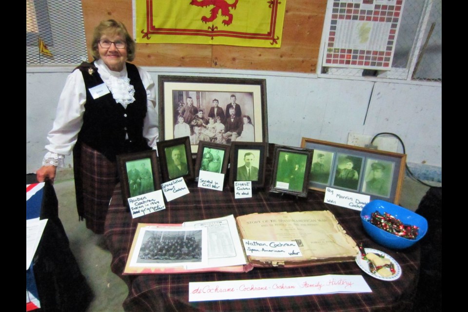 Grace Cochran of Elbow shows her family heritage display. More than 30 years of research unearthed the history of her family, which dates back to the 1200's to the Scottish Highlands.