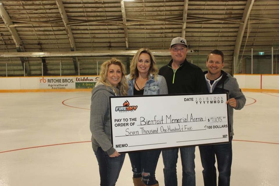 Participating in the donation to the Bienfait Memorial Arena were, from left, Bienfait Memorial Arena treasurer Amanda Pukas, Fire Sky Energy operations assistant Amanda Davidson, Fire Sky Energy project co-ordinator Matt Garagan and Fire Sky Energy production operations technologist Dustin Hockey.