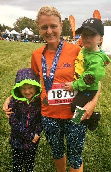 In 2016, after running a 21.1k marathon, Chantel Kitchen enjoyed a moment with her children, Emmett and Kacee (standing.)