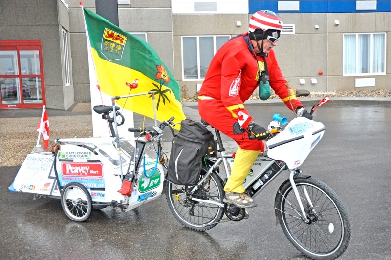 Danny “Hurricane” Halmo was in North Battleford Friday. This was right before he departed heading east, as the B.C.-based rider continues what he hopes will be a Guinness record-setting journey on his e-bike. Photos by John Cairns