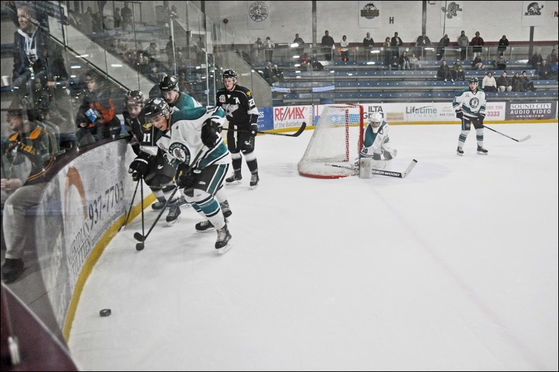 The North Stars try to find a way to put a goal past Merek Pipes of the La Ronge Ice Wolves.